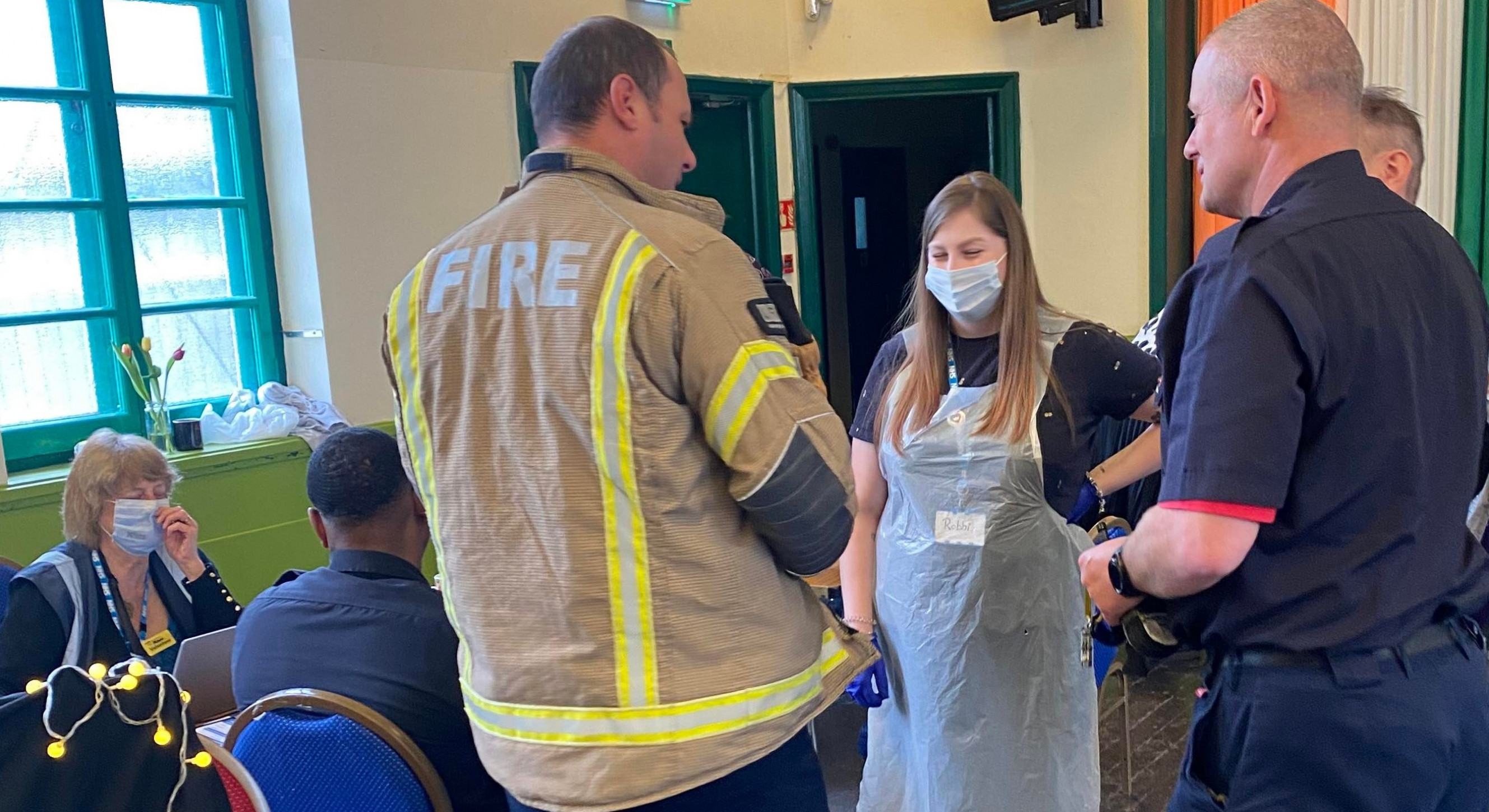 Local firefighters get their blood pressure checked while they raise awareness of fire safety