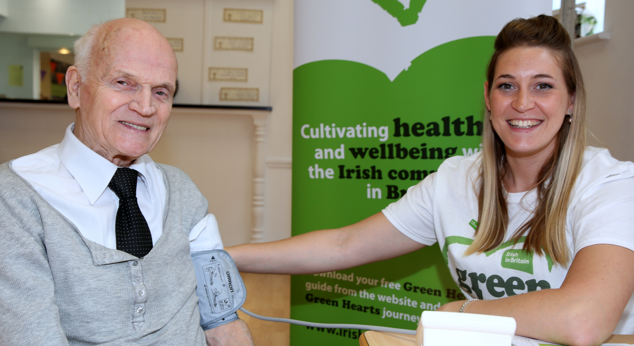 Volunteer, Dr Aisling Hillary, checks blood pressure as part of the Green Hearts health awareness campaign